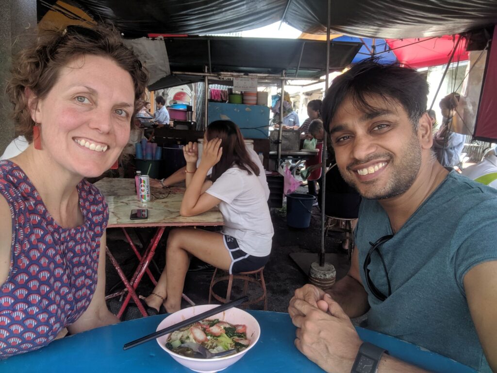 Two friends dining at a road side stall