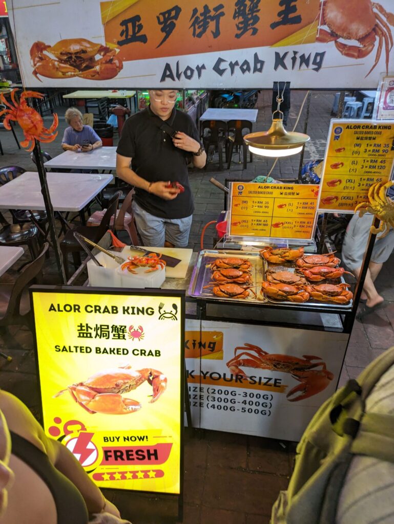 A night market stall selling crabs