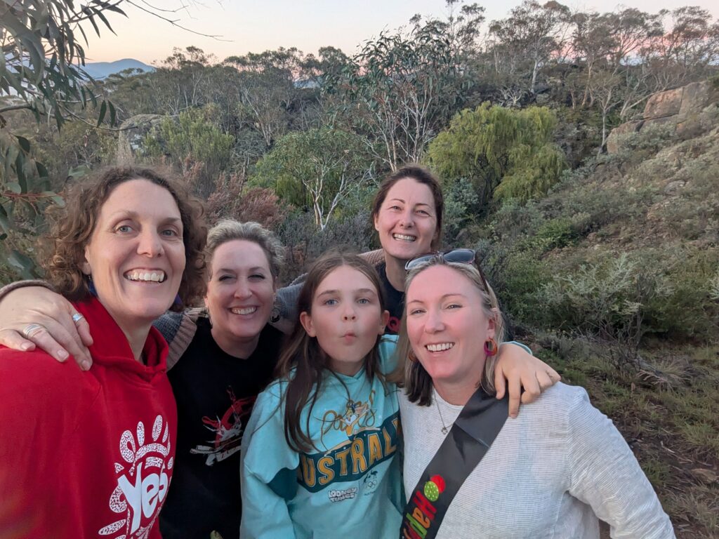 Five friends smiling at the camera