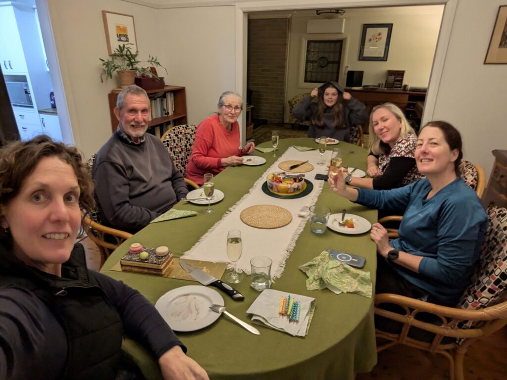 A group of friends around dining table