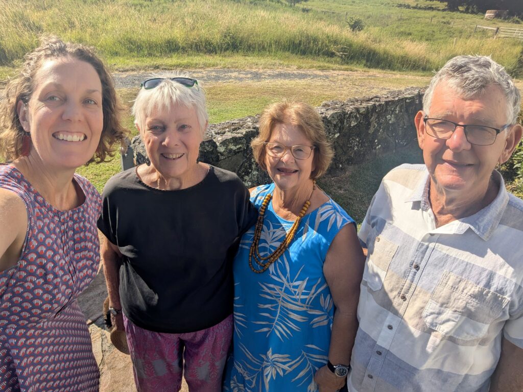 Four friends smiling at the camera