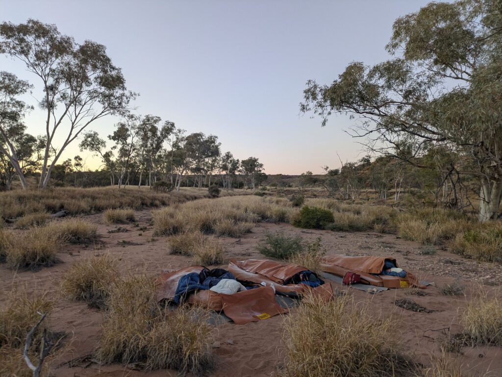 3 swags in a dry river bed in the early morning