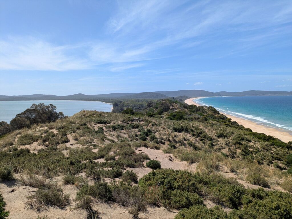 A view of the landscape from a highpoint on an isthmus, showing the separation of the water bodies