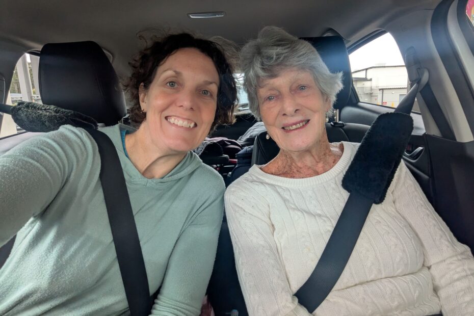 A selfie of two women in a car on a roadtrip